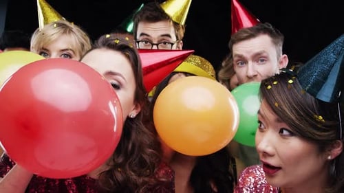 Party, confetti and people with balloons in studio for festive celebration
