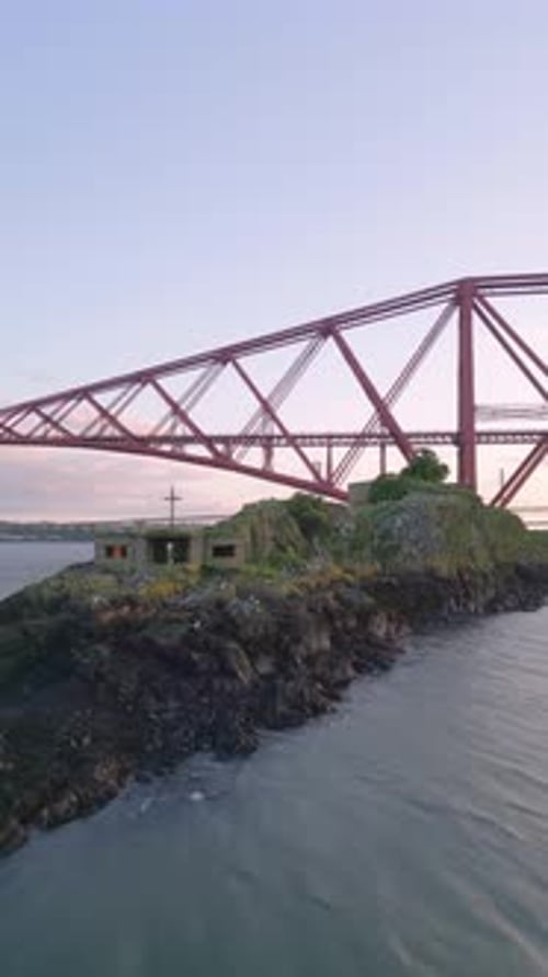 Inchgarvie cross and pillbox with the Forth Bridge behind