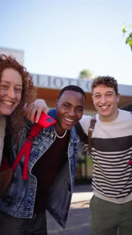 Group Young Diverse Students Standing Hugging Looking Laughing at Camera Outside the University