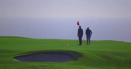 An Elderly Couple Plays Golf in France Sports for Rich People Who Walk on the Golf Course