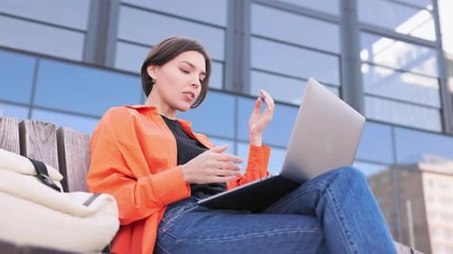 Confident Woman Having Video Meeting By Laptop in City