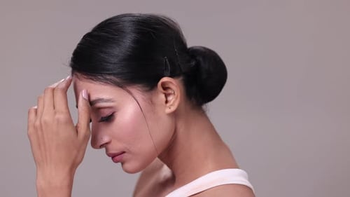 Elegant Woman Posing with Sleek Hair and Makeup