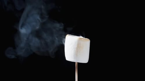 Toasted Marshmallow with Smoke on Black Background