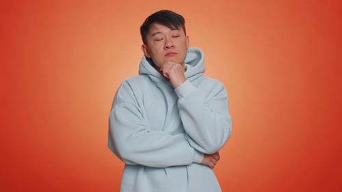 Young Adult Deep in Thought Posing Indoors