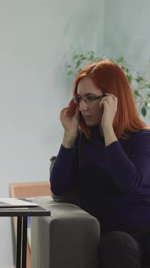 Freelancer Puts on Glasses to Protect Eyes While Working