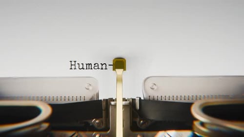 Old mechanical typewriter typing Human-ai Interaction in a close-up view.