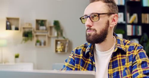 Man Working on Laptop at Home Close Up