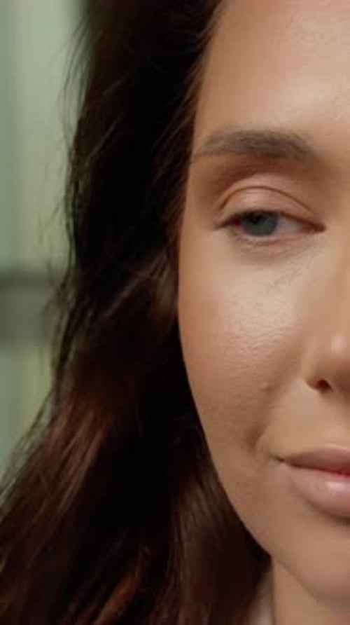 Woman Applying Makeup with Brush Close Up