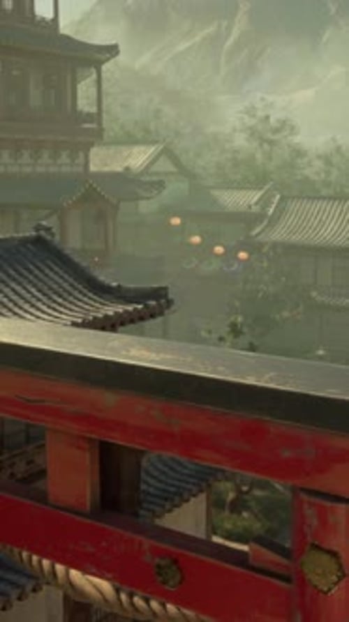 A Red Gate in Front of a Row of Buildings