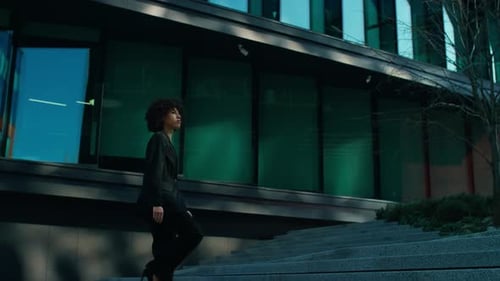 Confident Woman Walking to Work in City