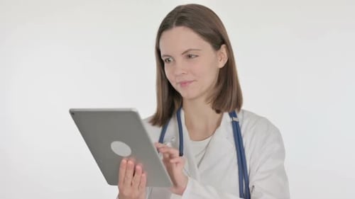 Female Doctor Using Tablet Computer for Patient Care