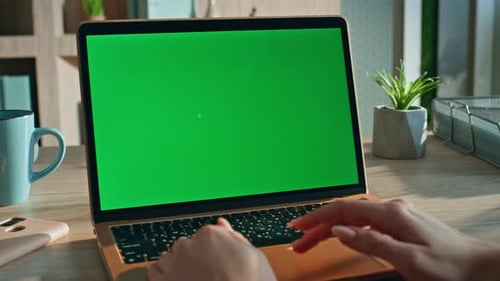 Woman Using Touchpad Chroma Key Laptop Surfing Internet at Workplace Close Up
