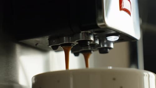 Espresso Machine Dispensing Coffee into Mug Close Up