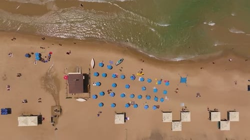 Locals and tourists enjoying a summer weekend day at the beach