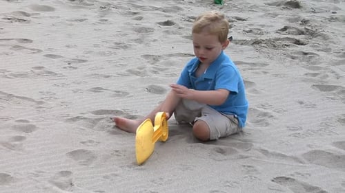 Boy Playing At Beach