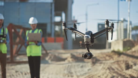 Two Specialists Use Drone on Construction Site. Architectural Engineer ...