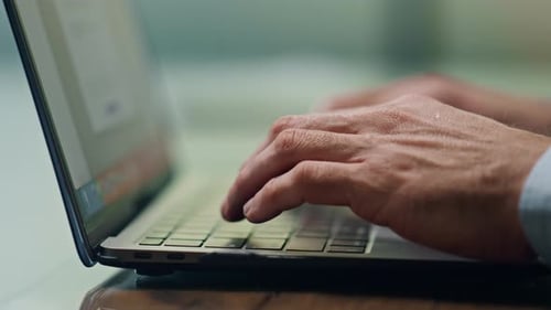 Man Hands Texting Laptop Keyboard at Office Closeup