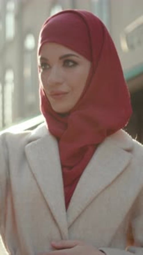 Elegant Woman in Red Headscarf Posing in City