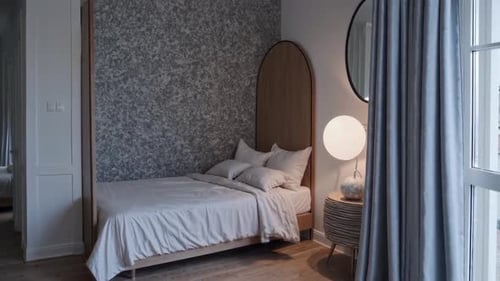 Enjoy a Cozy Modern Bedroom with Elegant Decor and Soft Lighting for Tranquility and Serenity