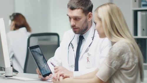 Doctor Explains X-Ray to Patient in Modern Clinic