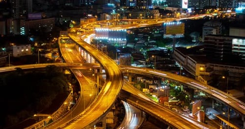 Video Aerial View of City Transportation at Night With Illuminated Skyline