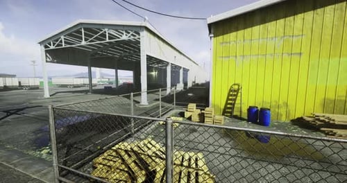 Entorno industrial en un área de almacén con edificio y almacenamiento amarillos