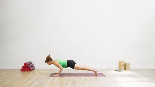 Woman in centered seated pose in modern studio