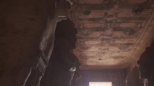 Inside the first hall of Abu Simbel with many Osiris statues.
