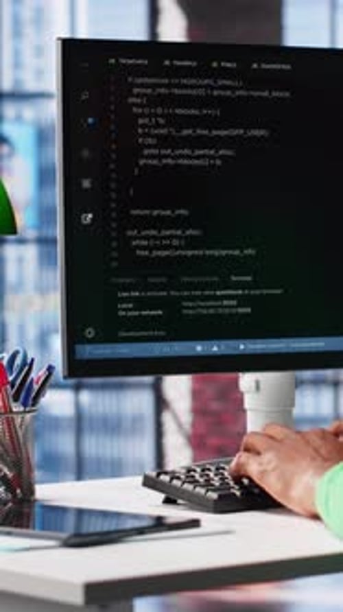 Vertical Video African American Software Developer Does Visual Coding and Creating Software