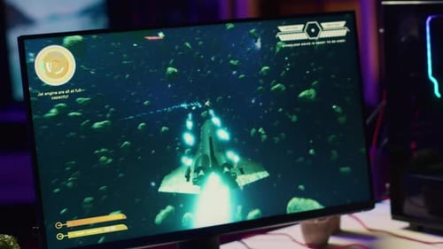 Close Up Shot of Computer Screen Showing Spaceship Flying Singleplayer
