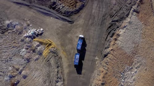 Aerial View of Truck Driving in Landfill