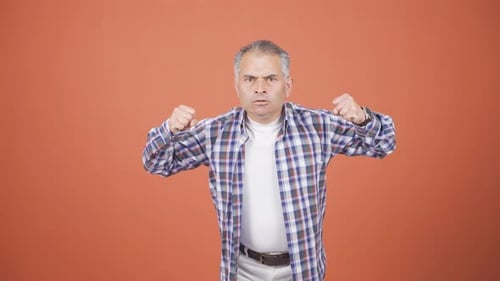 Man Expressing Anger and Frustration with Gestures