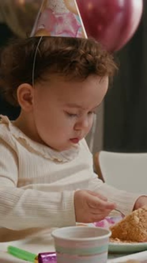 Baby Girl Enjoys Birthday Cake Celebration at Home