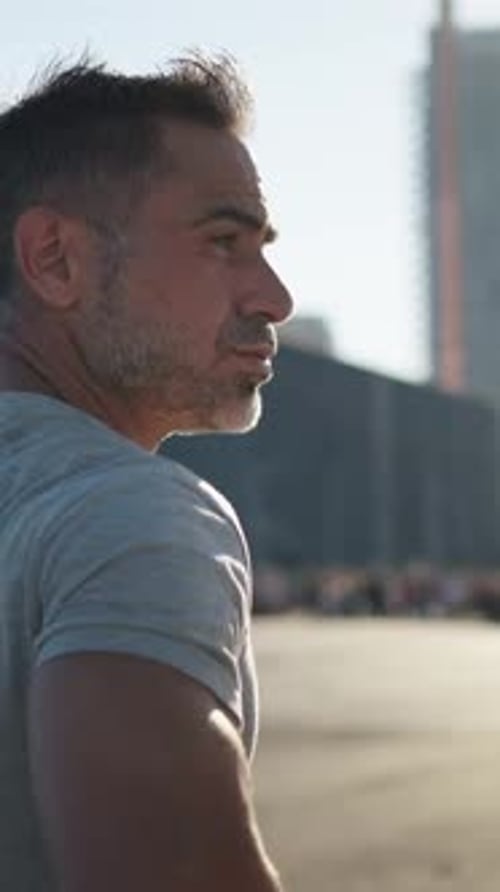 Rear View of Strong Handsome Mature Grey Male Athlete Running on Sunny Day Outdoors