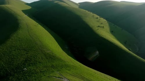 The Green Hills are Lit By the Sun Gradations of Shadow and Light on Hills Covered with Green