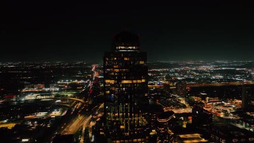 Aerial Night View of Glowing City Skyline