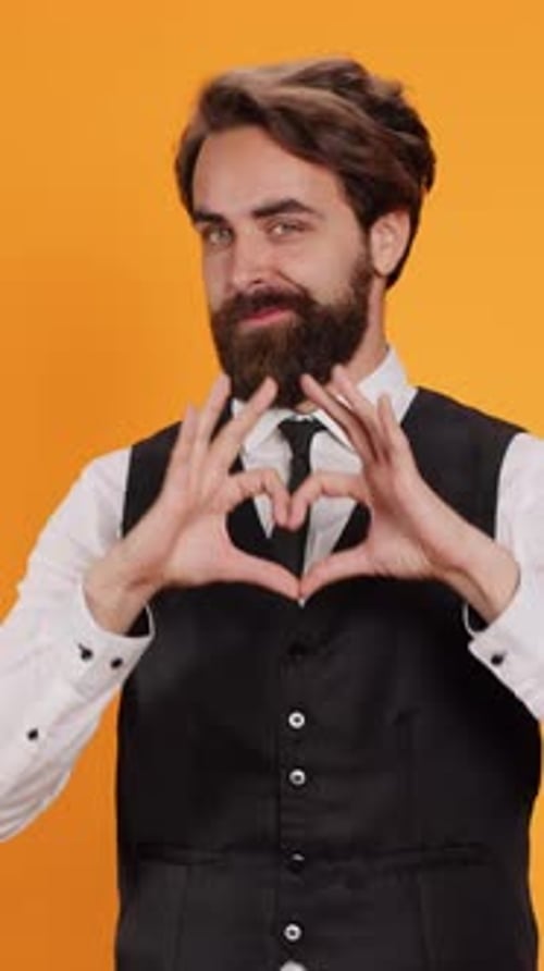 Vertical Video Butler Indicates Heart Shaped Sign