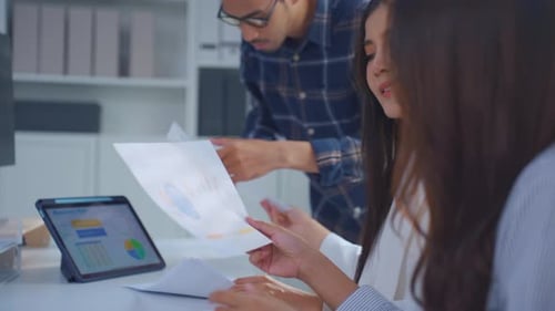 Group of Asian businessman and businesswoman working in the office.