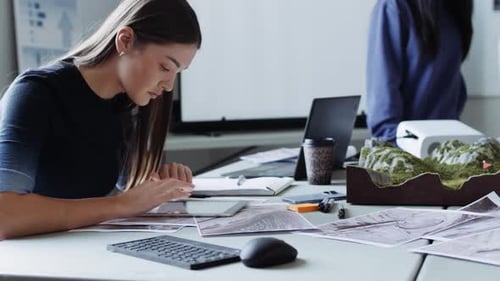Female Environmental Scientists with Topographic Maps in Meeting 2024 Years