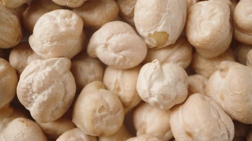A big pile of Chickpeas . View from above. Dolly slider extreme close-up.