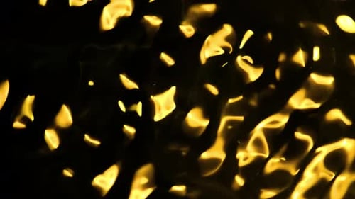 Des braises ardentes abstraites et dynamiques qui brillent intensément sur un fond sombre, évoquant chaleur et énergie