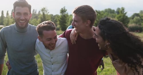 Friends Together Laughing Outside in a Park