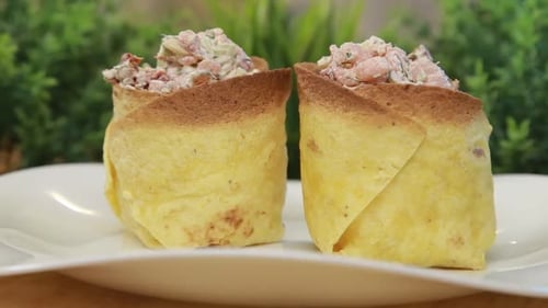 Crepe Rolls with Shrimp and Vegetables Stuffing on a Plate