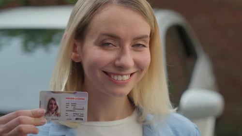 Joyful Caucasian Businesswoman Girl Close Up Smiling Hold Driver License Id Certificate in City