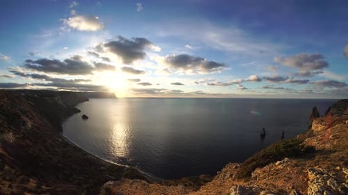 Sea Landscape with Rocky Coastline on Sunset Time with Cloudy Sky