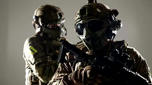 Two Unrecognizable Soldiers in Modern Equipment and Guns in Hand Portrait in Studio
