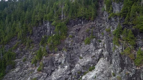 Aerial Cinematic View of Rocky Mountain Landscape Cloudy Sunny Day Taken in BC Canada