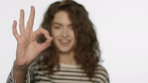 Smiling Girl Showing Ok Hand in Studio. Portrait of Smiling Woman Showing