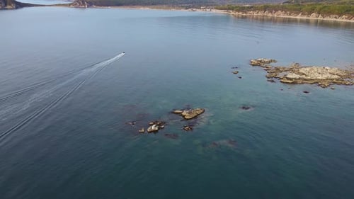 Aerial View of Speedboat in Bay Near Coast