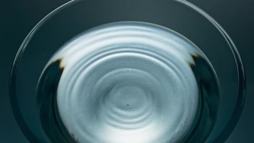Water Drop Ripples in Glass Container, Abstract